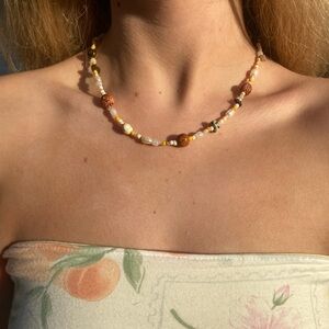 Handbeaded Necklace with Gold and Brown Accents